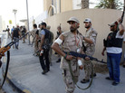 In Tripoli on Wednesday (Aug. 24, 2011), opposition fighters searched for Moammar Gadhafi and his relatives. In Tripoli on Wednesday (Aug. 24, 2011), opposition fighters searched for Moammar Gadhafi and his relatives.