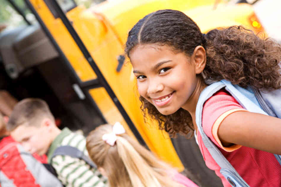A girl in line for the school bus. A girl in line for the school bus.