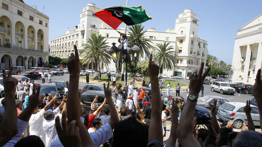 Libyans show their support for the rebellion after Friday prayers near Green Square in Tripoli.