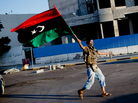 In Tripoli on Thursday (Aug. 25, 2011), this anti-Gadhafi fighter celebrated. In Tripoli on Thursday (Aug. 25, 2011), this anti-Gadhafi fighter celebrated.