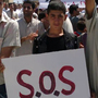 In an image taken by a citizen journalist and provided by Shaam News Network, protesters in the Syrian village of Maaret Harma in Edlib province march against the regime of President Bashar Assad,  Aug. 26. The government has banned most foreign journalists in the country and is continuing a brutal crackdown on anti-government activists.