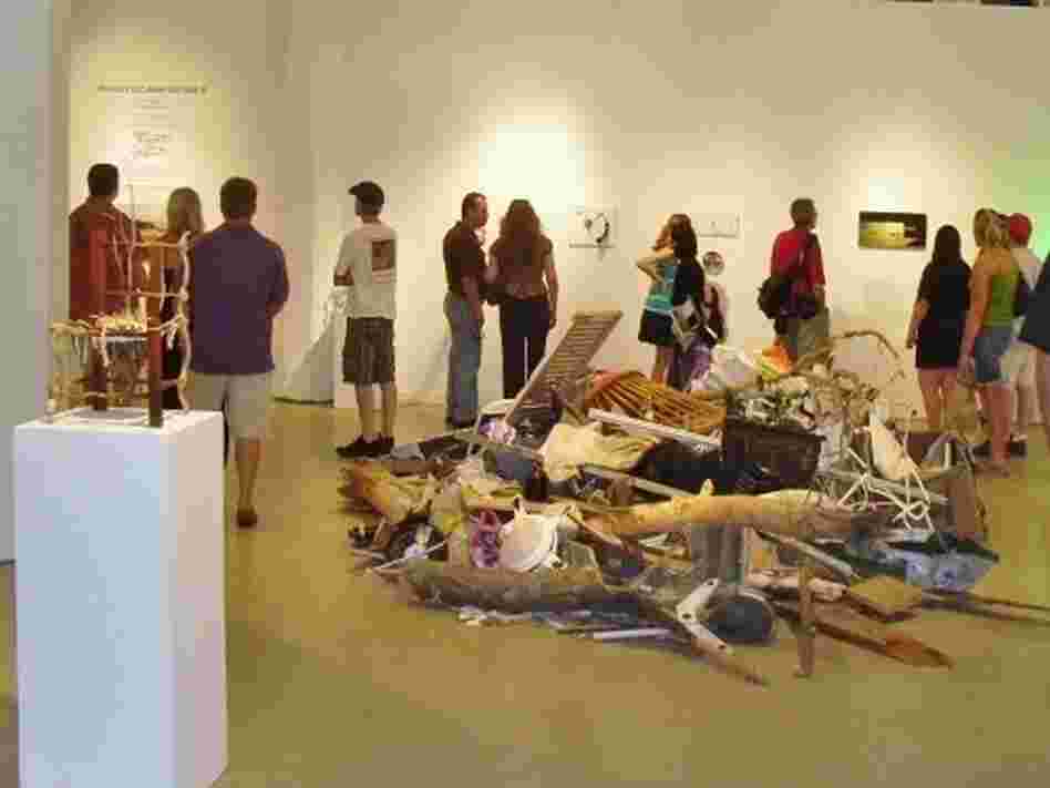 A crowd previews a selection of art from the Reclamation Project, which has reused debris from the tornado in Joplin, Mo. A crowd previews a selection of art from the Reclamation Project, which has reused debris from the tornado in Joplin, Mo.