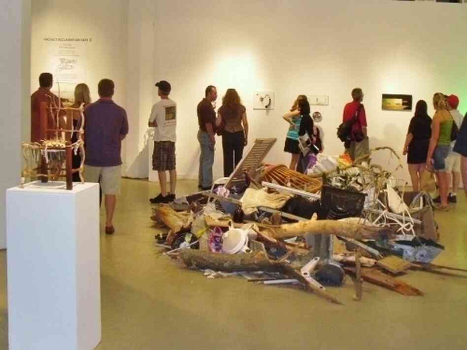 A crowd previews a selection of art from the Reclamation Project, which has reused debris from the tornado in Joplin, Mo. A crowd previews a selection of art from the Reclamation Project, which has reused debris from the tornado in Joplin, Mo.