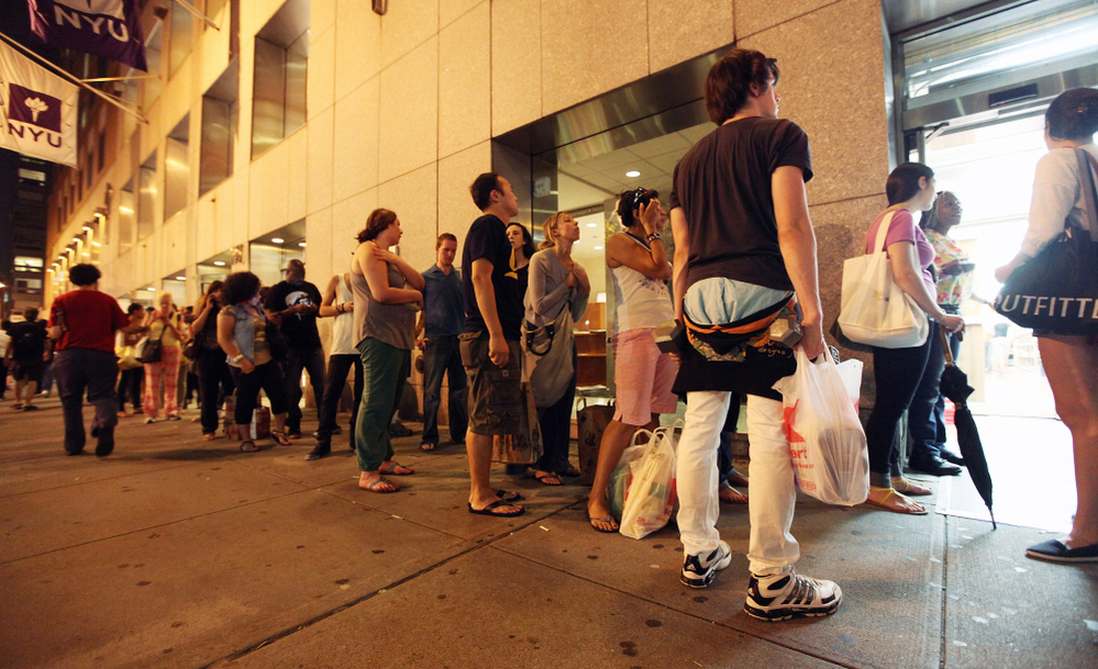 People stand in line at a Trader Joe's Wine Shop in Manhattan Friday, ahead of Hurricane Irene's arrival in New York City this weekend.