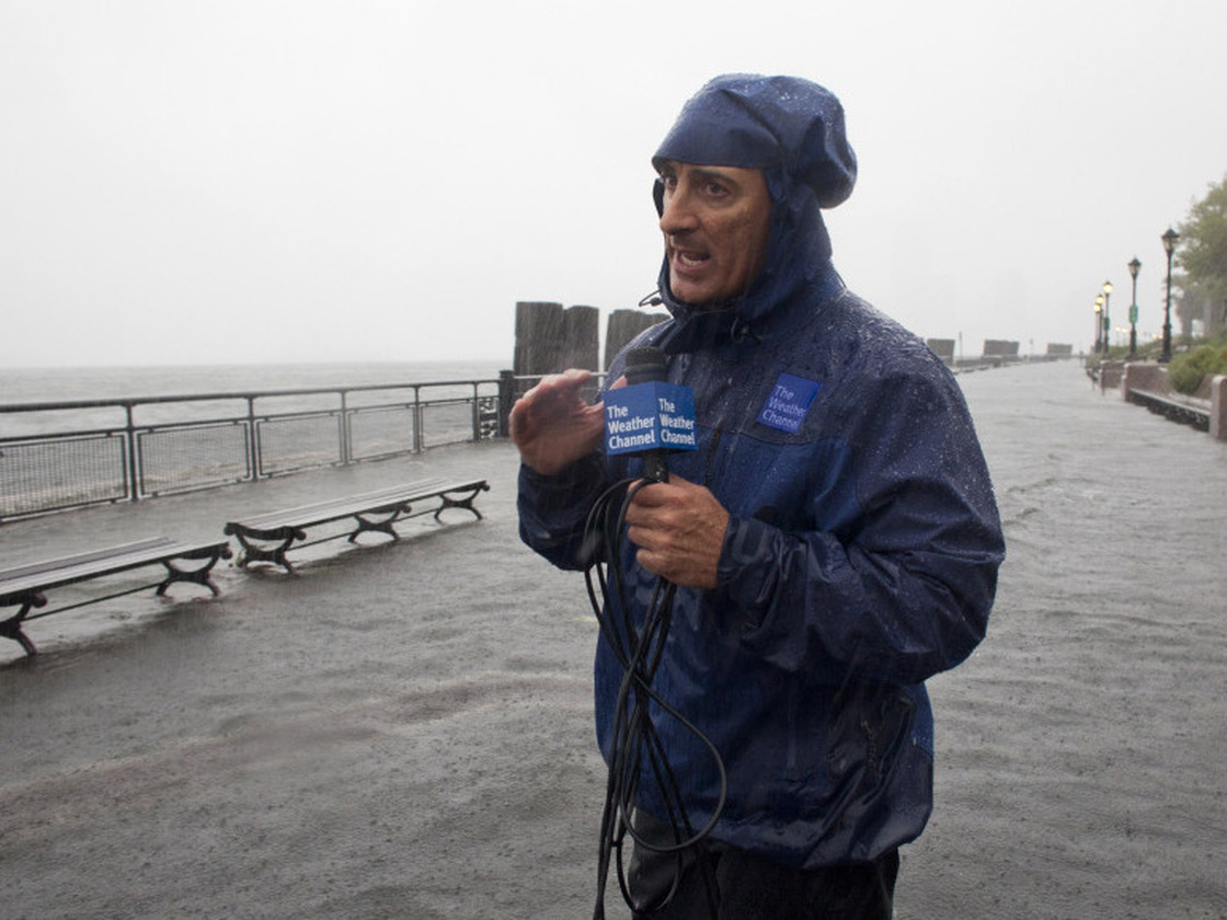 In this handout image provided by The Weather Channel, Jim Cantore reports on Hurricane Irene from Battery Park on Sunday.
