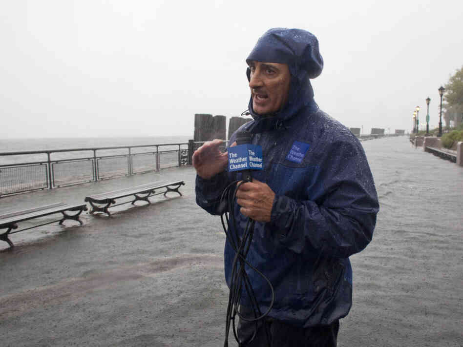 In this handout image provided by The Weather Channel, Jim Cantore reports on Hurricane Irene from Battery Park on Sunday.