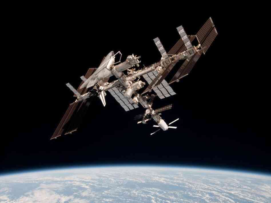 The International Space Station and the docked space shuttle Endeavour, flying at an altitude of approximately 220 miles, on May 23, 2011.