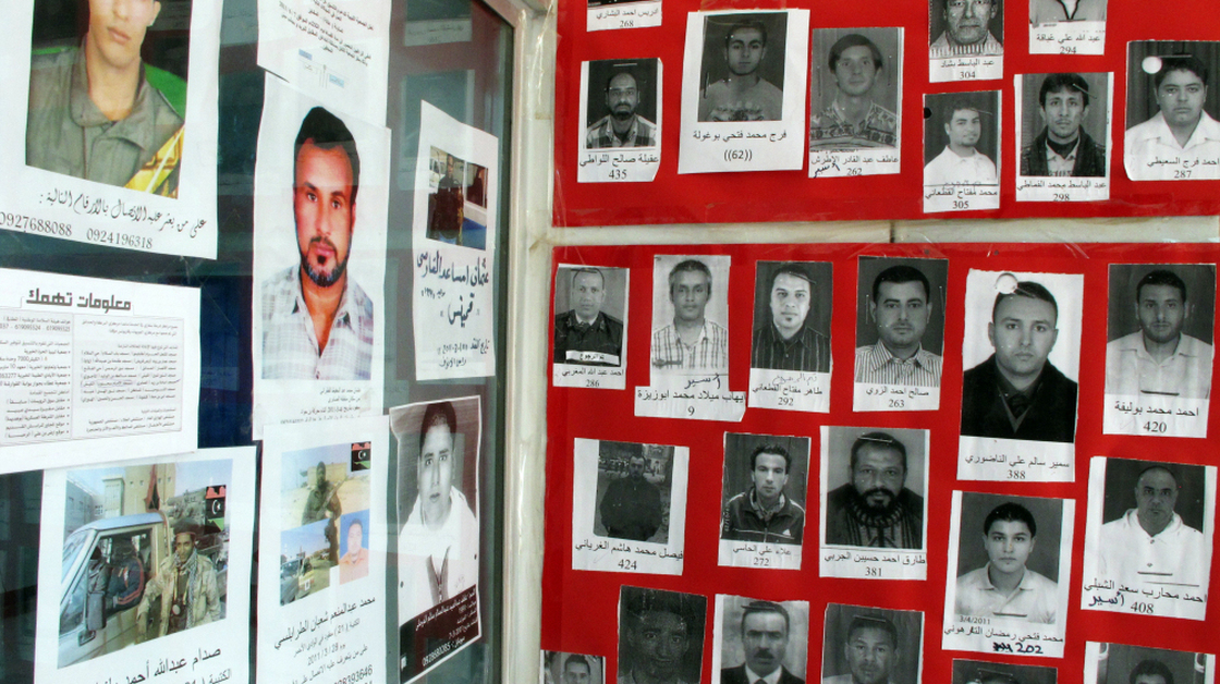 The walls of the Libyan Red Crescent office in Benghazi, Libya, shown here on Monday, are covered with photos of the missing. Some disappeared during Libya's revolution, but some have been missing for more than 10 years. Now, thousands released from Libya's prisons are being reunited with their families.