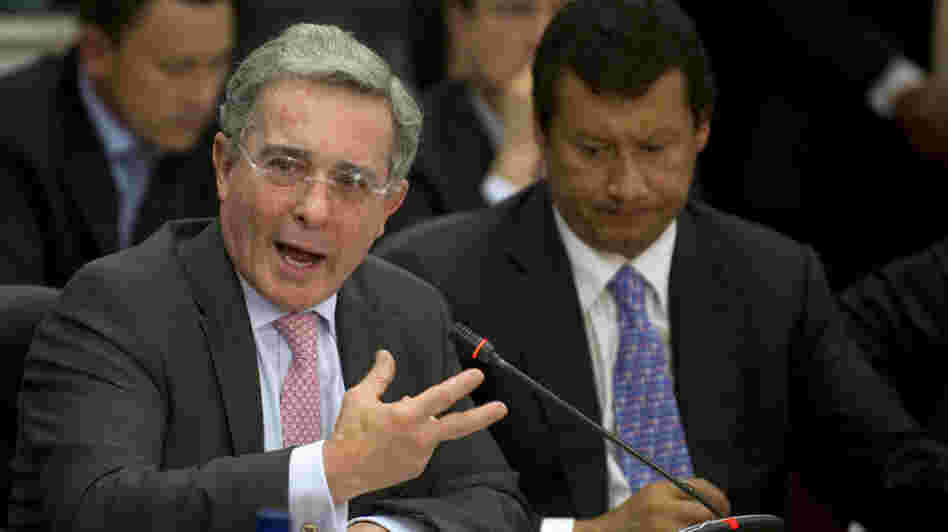 Former Colombian President Alvaro Uribe (left) speaks during a public congressional hearing in Bogota earlier this month about allegations that the country's intelligence service spied on high court judges during his government. Former Colombian President Alvaro Uribe (left) speaks during a public congressional hearing in Bogota earlier this month about allegations that the country's intelligence service spied on high court judges during his government.
