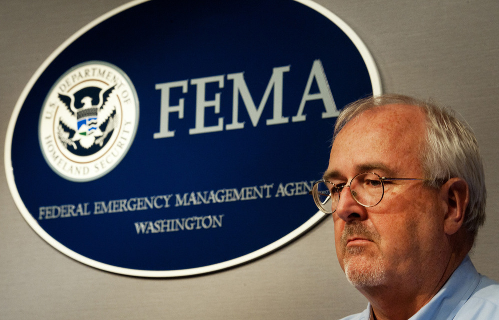 FEMA Administrator Craig Fugate, shown at a press briefing last week in Washington, says his agency will postpone some repair work on earlier disasters in order to pay for the immediate needs of Irene.