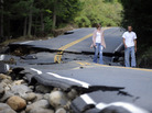 Jarrid Gonyea and his wife, Michelle, check out damage caused by Tropical Storm Irene on Hurricane Road in Keene, N.Y., on Monday. The costs of the storm that stretched across the Eastern Seaboard are estimated to be in the billions. Jarrid Gonyea and his wife, Michelle, check out damage caused by Tropical Storm Irene on Hurricane Road in Keene, N.Y., on Monday. The costs of the storm that stretched across the Eastern Seaboard are estimated to be in the billions.
