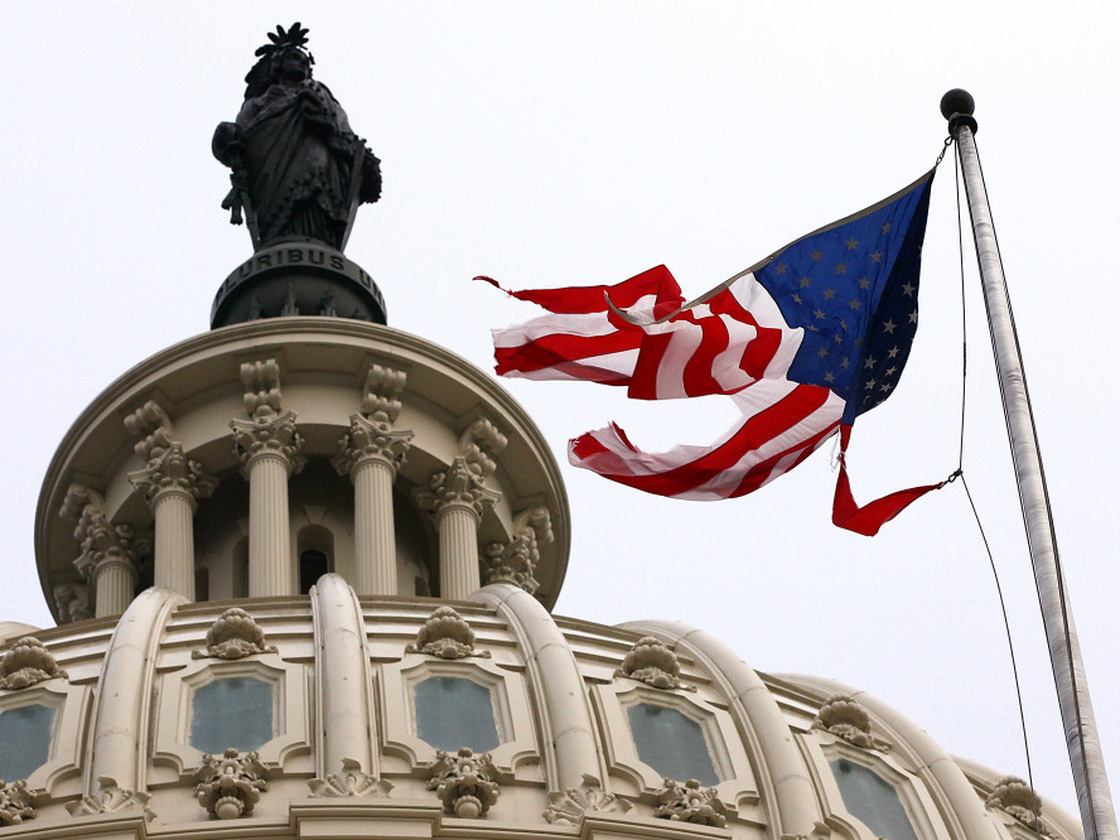 Irene's winds tore the flag that was flying in front of the U.S. Capitol on Sunday.