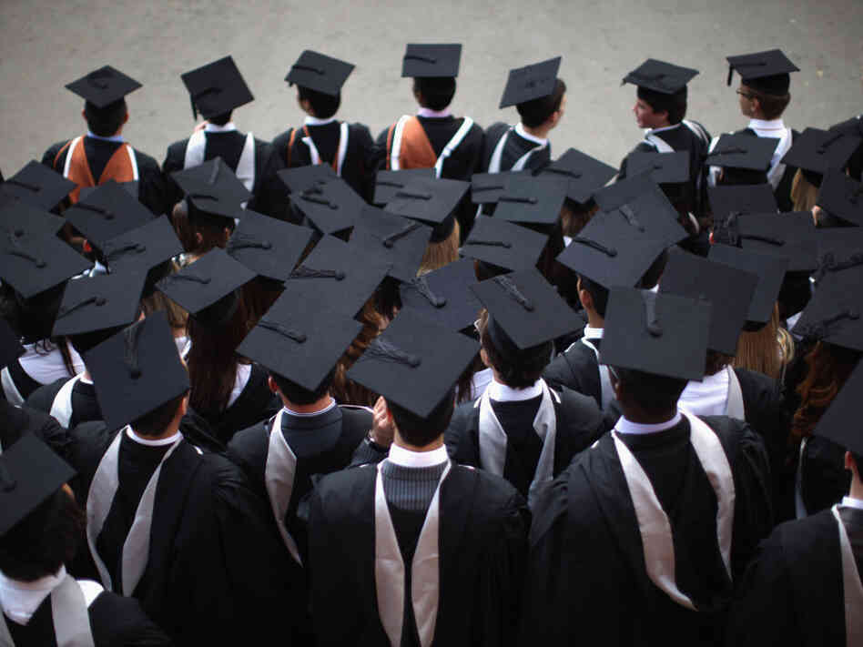 BIRMINGHAM, ENGLAND - JULY 14: Students pose for their official group photograph at the University of Birmingham as they take part in their degree congregations on July 14, 2011 in Birmingham, England. BIRMINGHAM, ENGLAND - JULY 14: Students pose for their official group photograph at the University of Birmingham as they take part in their degree congregations on July 14, 2011 in Birmingham, England.