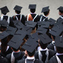 BIRMINGHAM, ENGLAND - JULY 14: Students pose for their official group photograph at the University of Birmingham as they take part in their degree congregations on July 14, 2011 in Birmingham, England. BIRMINGHAM, ENGLAND - JULY 14: Students pose for their official group photograph at the University of Birmingham as they take part in their degree congregations on July 14, 2011 in Birmingham, England.