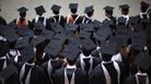 BIRMINGHAM, ENGLAND - JULY 14: Students pose for their official group photograph at the University of Birmingham as they take part in their degree congregations on July 14, 2011 in Birmingham, England. BIRMINGHAM, ENGLAND - JULY 14: Students pose for their official group photograph at the University of Birmingham as they take part in their degree congregations on July 14, 2011 in Birmingham, England.