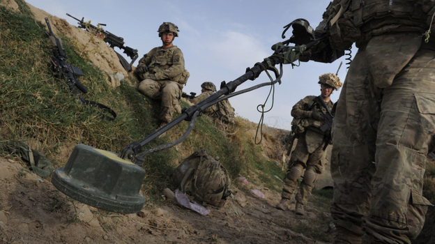 U.S. soldiers check for land mines on a canal running through Highway 1 in Afghanistan's Kandahar province, Aug. 6. Improvised explosive devices, or IEDs, are the Taliban's weapon of choice and are the leading killer of civilians and soldiers in Afghanistan. U.S. soldiers check for land mines on a canal running through Highway 1 in Afghanistan's Kandahar province, Aug. 6. Improvised explosive devices, or IEDs, are the Taliban's weapon of choice and are the leading killer of civilians and soldiers in Afghanistan.