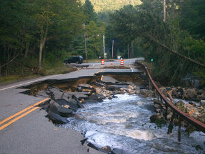Roaring Brook flows onto Route 73 in Keene, N.Y., on Tuesday. Roaring Brook flows onto Route 73 in Keene, N.Y., on Tuesday.