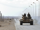 Libyan rebel fighters advance in their tank about 60 miles east of the town of Sirte on Tuesday. Sirte is Moammar Gadhafi's hometown and the last bastion of his loyalist forces. Libyan rebel fighters advance in their tank about 60 miles east of the town of Sirte on Tuesday. Sirte is Moammar Gadhafi's hometown and the last bastion of his loyalist forces.