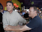 Republican presidential hopeful Texas Gov. Rick Perry (left) shakes hands with a supporter as he goes onstage at the Polk County GOP summer picnic event held at the Iowa State Fairgrounds in Des Moines on Saturday. Republican presidential hopeful Texas Gov. Rick Perry (left) shakes hands with a supporter as he goes onstage at the Polk County GOP summer picnic event held at the Iowa State Fairgrounds in Des Moines on Saturday.