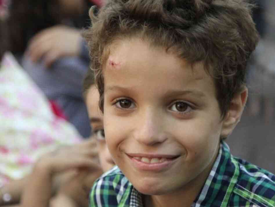 Jihad Anas, 10, celebrates Eid with his family. Jihad Anas, 10, celebrates Eid with his family.