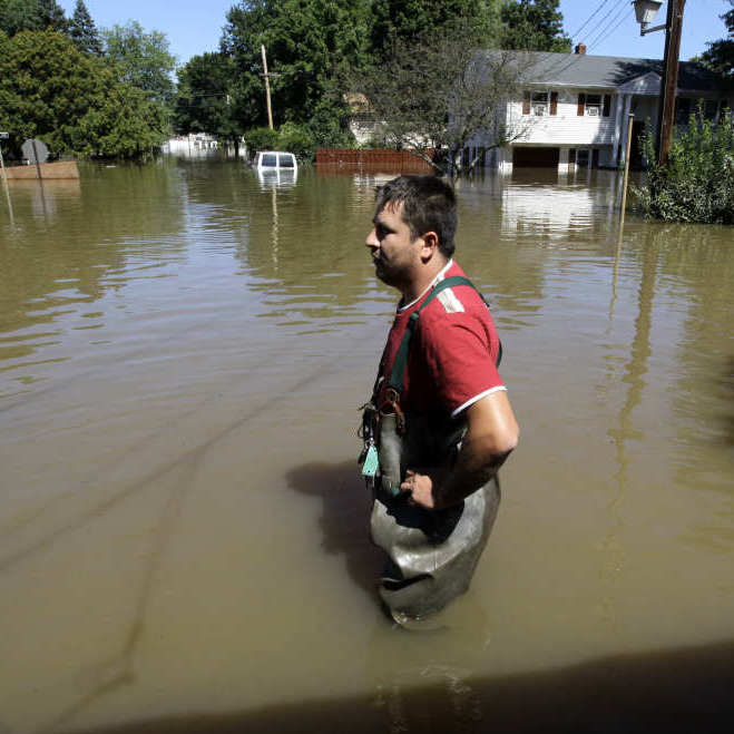 In Pompton Lakes, N.J., earlier this week, Gino Borova stood in the driveway of his house — which was flooded by water from the Ramapo River.