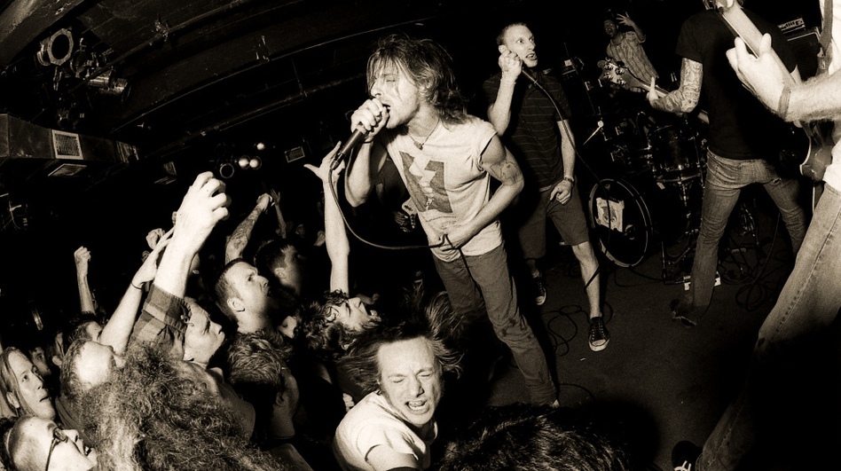 Chris Taylor (center) and Bryan Funck (Thou's vocalist, stepping in for Blake Midgette) of pg. 99 perform at the Black Cat.