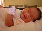 Maximilian Dominic Mecenas-Sarmiento, born Aug. 17, "smiles" for the camera. Maximilian Dominic Mecenas-Sarmiento, born Aug. 17, "smiles" for the camera.