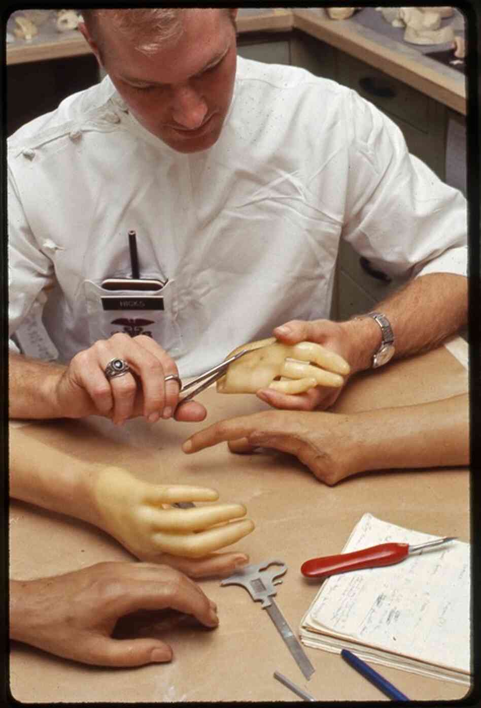 A technician works on a set of lifelike hands in the 1960s. For as long as Walter Reed has been around, it has been creating improved prostheses for injured veterans. 