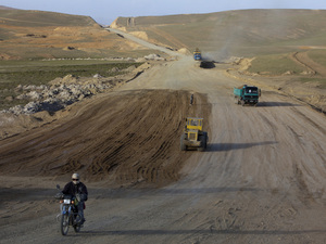 A motorcyclist rides along the still under construction Bamiyan-Yakawlang road in Yakawlang, Afghanistan, June 10. Despite the construction of new roads, many of them are unsafe to drive. A motorcyclist rides along the still under construction Bamiyan-Yakawlang road in Yakawlang, Afghanistan, June 10. Despite the construction of new roads, many of them are unsafe to drive.