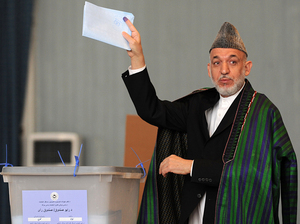Afghan President Hamid Karzai gestures before casting his vote at a polling station in Kabul, Sept. 18, 2010, in parliamentary elections that were marred by allegations of fraud. Afghan President Hamid Karzai gestures before casting his vote at a polling station in Kabul, Sept. 18, 2010, in parliamentary elections that were marred by allegations of fraud.