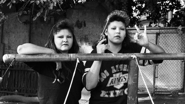 BooBoo (right) flashes a Playboys gang hand sign, 1993. (Robert Yager)