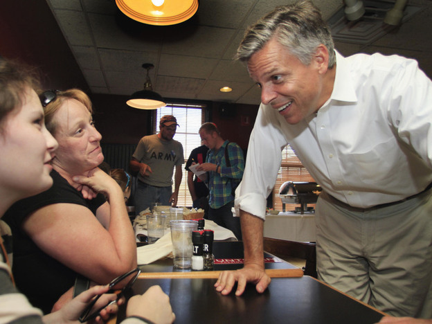 Huntsman, campaigning last month in the Granite State, speaks with Sara Brothers (left) and Rebecca Brothers at the Barley House restaurant in Concord.