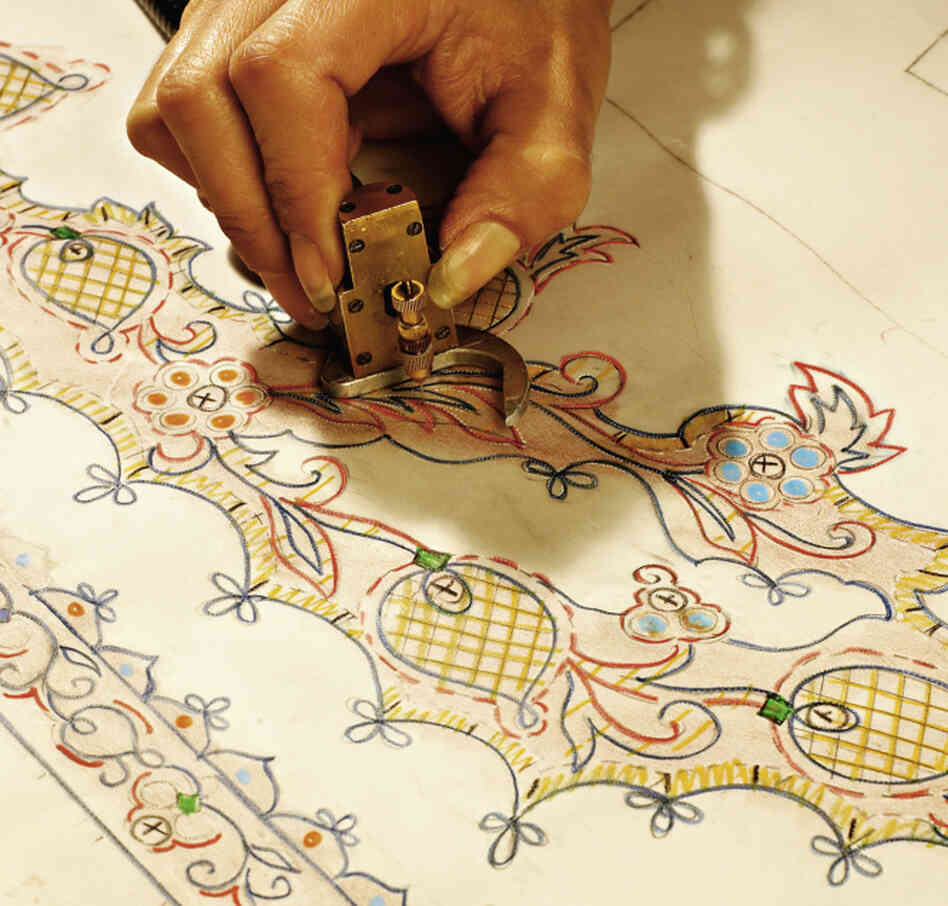 Petites mains — little hands, as they are affectionately called — are behind all of the studio's creations. Designs are carefully drawn out before the sewing begins.