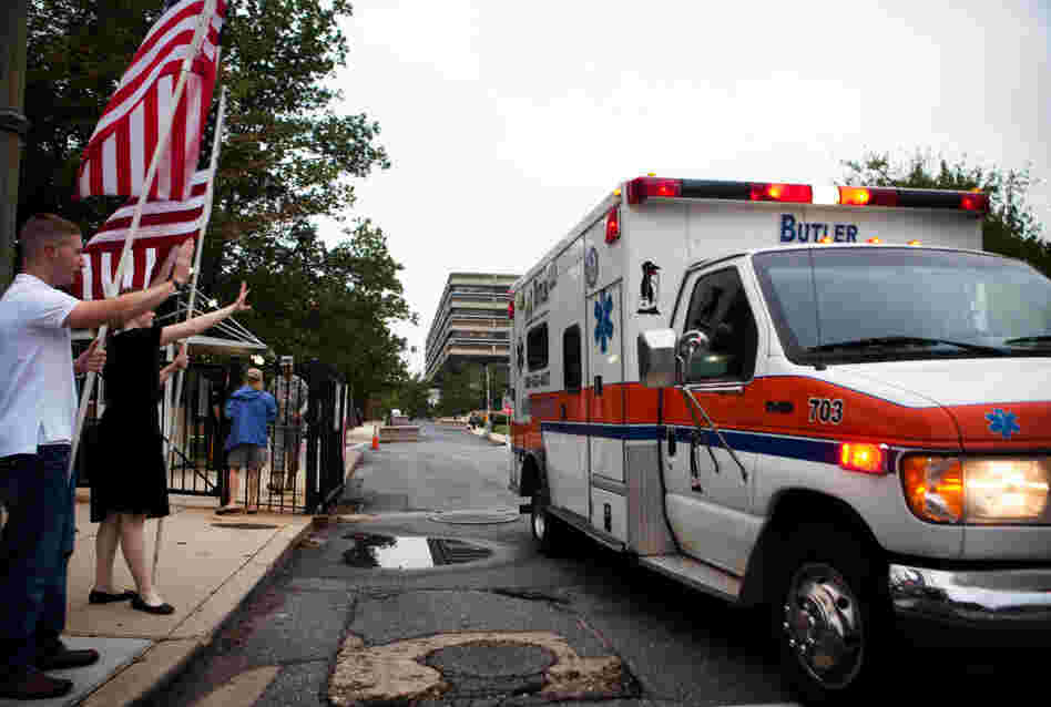Supporters from the D.C chapter of Free Republic send off the final patients from Walter Reed Army Medical Center on Saturday.