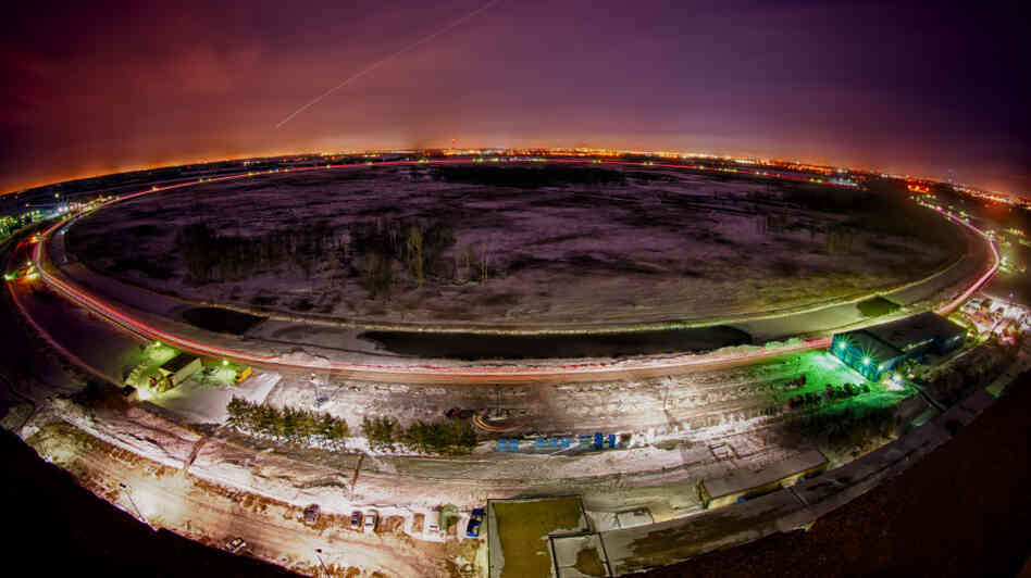 Vehicle lights and shooting stars illuminate the four-mile-long Tevatron ring.