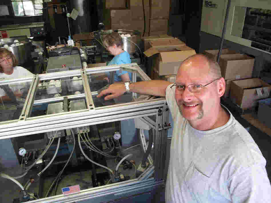 Stephen Mullany, who runs The Wiffle Ball Inc. with his brother David, poses in front of the machine that presses the two plastic ball halves together at a factory in Shelton, Conn. Mullany's grandfather invented the Wiffle Ball in the 1950s. Stephen Mullany, who runs The Wiffle Ball Inc. with his brother David, poses in front of the machine that presses the two plastic ball halves together at a factory in Shelton, Conn. Mullany's grandfather invented the Wiffle Ball in the 1950s.