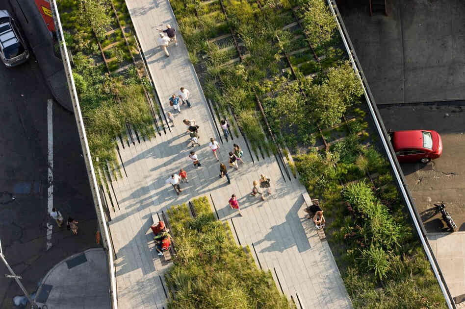 The High Line's Washington Grasslands sit below the Standard, a hotel that was built above the historic rail line. 