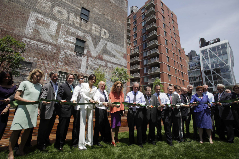 Supporters of the High Line, including Mayor Michael Bloomberg (center), celebrate the opening of the park's second section on June 7. Friends of the High Line founders Joshua David and Robert Hammond cite Bloomberg's election as a turning point in their 10-year effort to save the historic rail line. 