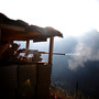 Pfc. Natan Martinez fires a machine gun at an enemy fighting position near the Pakistan border in Afghanistan. Pfc. Natan Martinez fires a machine gun at an enemy fighting position near the Pakistan border in Afghanistan.