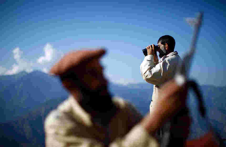 A member of the Afghan Security Guards keeps a watchful eye on the mountains surrounding the Kunar River Valley.