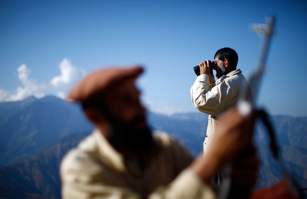 A member of the Afghan Security Guards keeps a watchful eye on the mountains surrounding the Kunar River Valley.