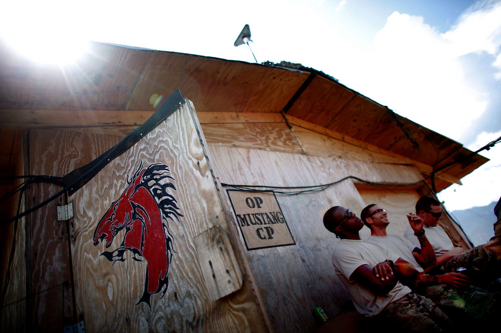 Spc. Jermaine Aikens (left), Sgt. Eric Scharf (center) and Pfc. Michael Montierth (right) talk at Observation Post Mustang.