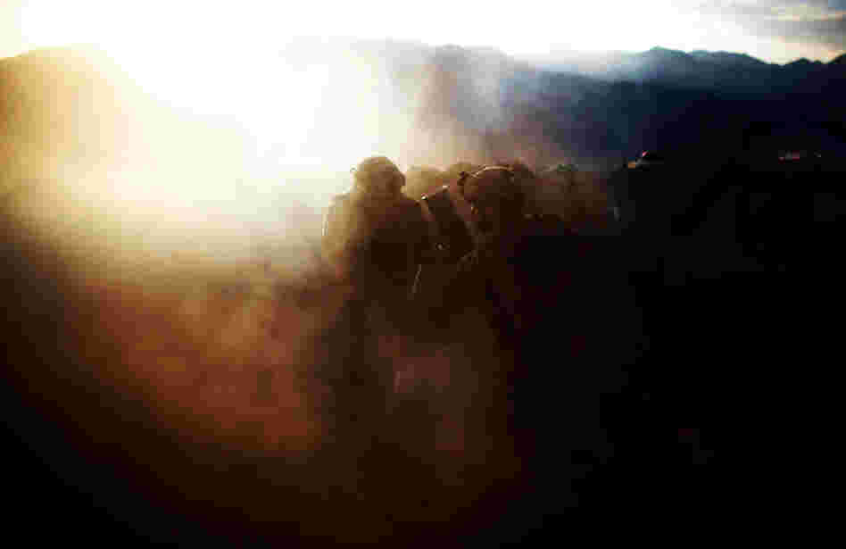 Pfc. Natan Martinez (left) and Spc. Frederick (right) fire an explosive round at a suspected enemy.
