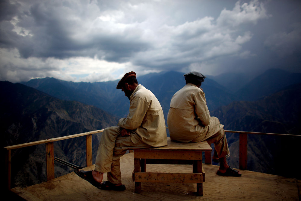 Afghan Security Guards look over the Kunar river valley.