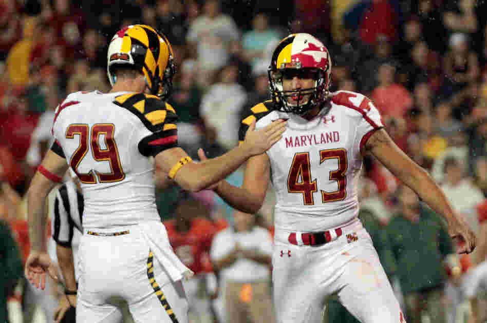 Holder Michael Tart #29 celebrates a late fourth quarter field goal with kicker Nick Ferrara #43 of the Maryland Terrapins against the Miami Hurricanes.