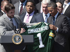 President Obama is presented with a Green Bay Packers football jersey by quarterback Aaron Rodgers (left) during a White House ceremony on Aug. 12 honoring the Super Bowl XLV champions. President Obama is presented with a Green Bay Packers football jersey by quarterback Aaron Rodgers (left) during a White House ceremony on Aug. 12 honoring the Super Bowl XLV champions.