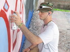 Art's Sake: Dominic "Dom" Fredianelli is the linchpin of a group of young Michigan men who go off to war — and return home bearing its scars — in Where Soldiers Come From. An art student at Finlandia University, Fredianelli channeled his experiences into a massive mural in his hometown. Art's Sake: Dominic "Dom" Fredianelli is the linchpin of a group of young Michigan men who go off to war — and return home bearing its scars — in Where Soldiers Come From. An art student at Finlandia University, Fredianelli channeled his experiences into a massive mural in his hometown.