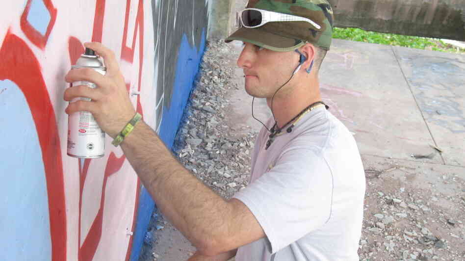 Art's Sake: Dominic "Dom" Fredianelli is the linchpin of a group of young Michigan men who go off to war — and return home bearing its scars — in Where Soldiers Come From. An art student at Finlandia University, Fredianelli channeled his experiences into a massive mural in his hometown. Art's Sake: Dominic "Dom" Fredianelli is the linchpin of a group of young Michigan men who go off to war — and return home bearing its scars — in Where Soldiers Come From. An art student at Finlandia University, Fredianelli channeled his experiences into a massive mural in his hometown.