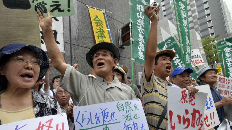 Farmers whose crops were ruined by a nuclear accident protest Aug. 3 at the Tokyo Electric Power Co. Many Japanese are calling for the country to lessen its dependence on nuclear power following the accident six months ago. Farmers whose crops were ruined by a nuclear accident protest Aug. 3 at the Tokyo Electric Power Co. Many Japanese are calling for the country to lessen its dependence on nuclear power following the accident six months ago.