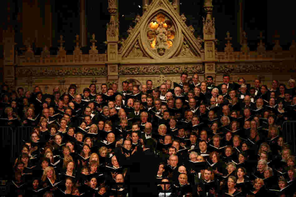 Conductor Julian Wachner with the six choirs during "Remember to Love: Let Us Love One Another With A Sincere Heart."